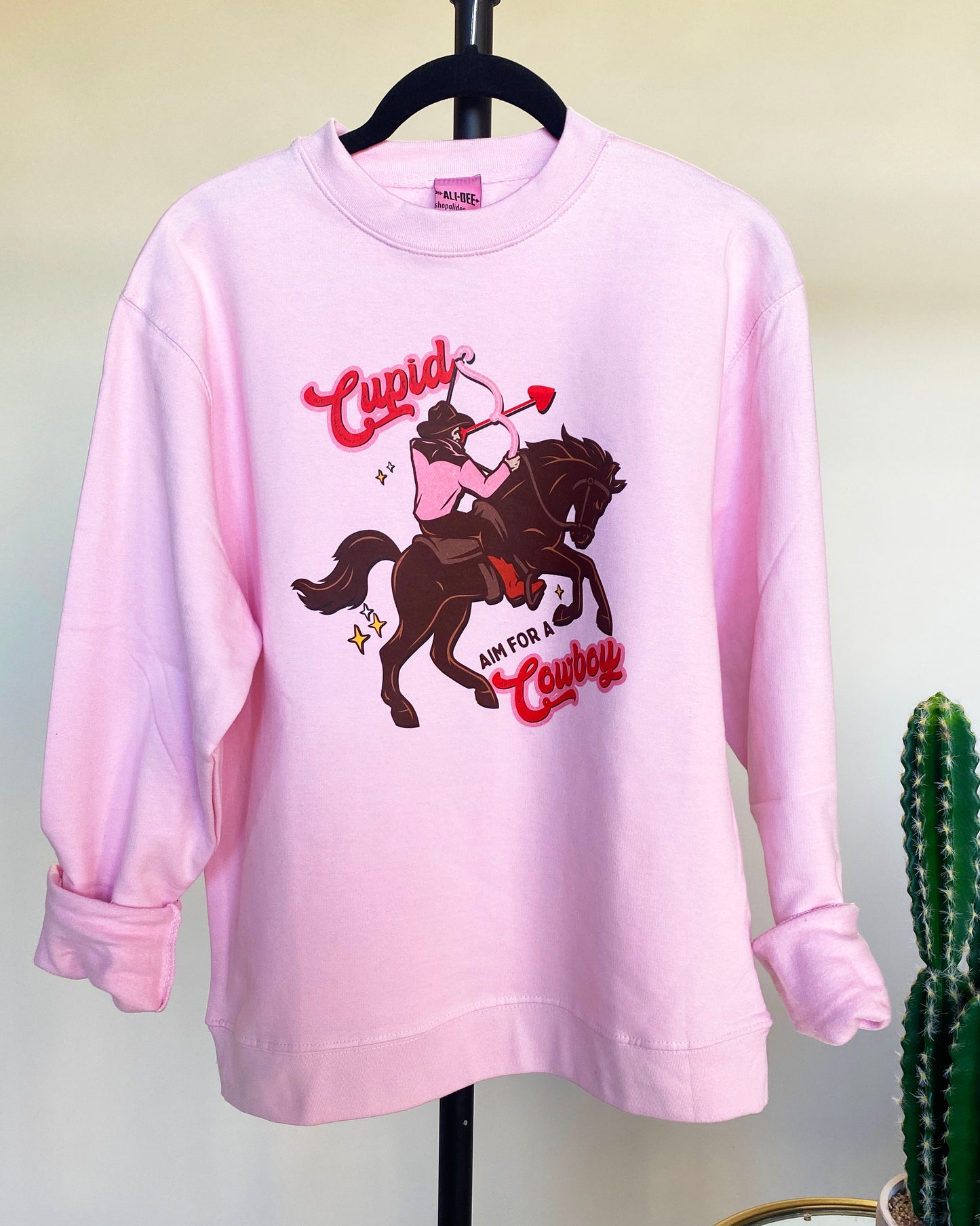 Cupid Aim for A Cowboy Valentines Day Graphic Sweatshirt - Pink