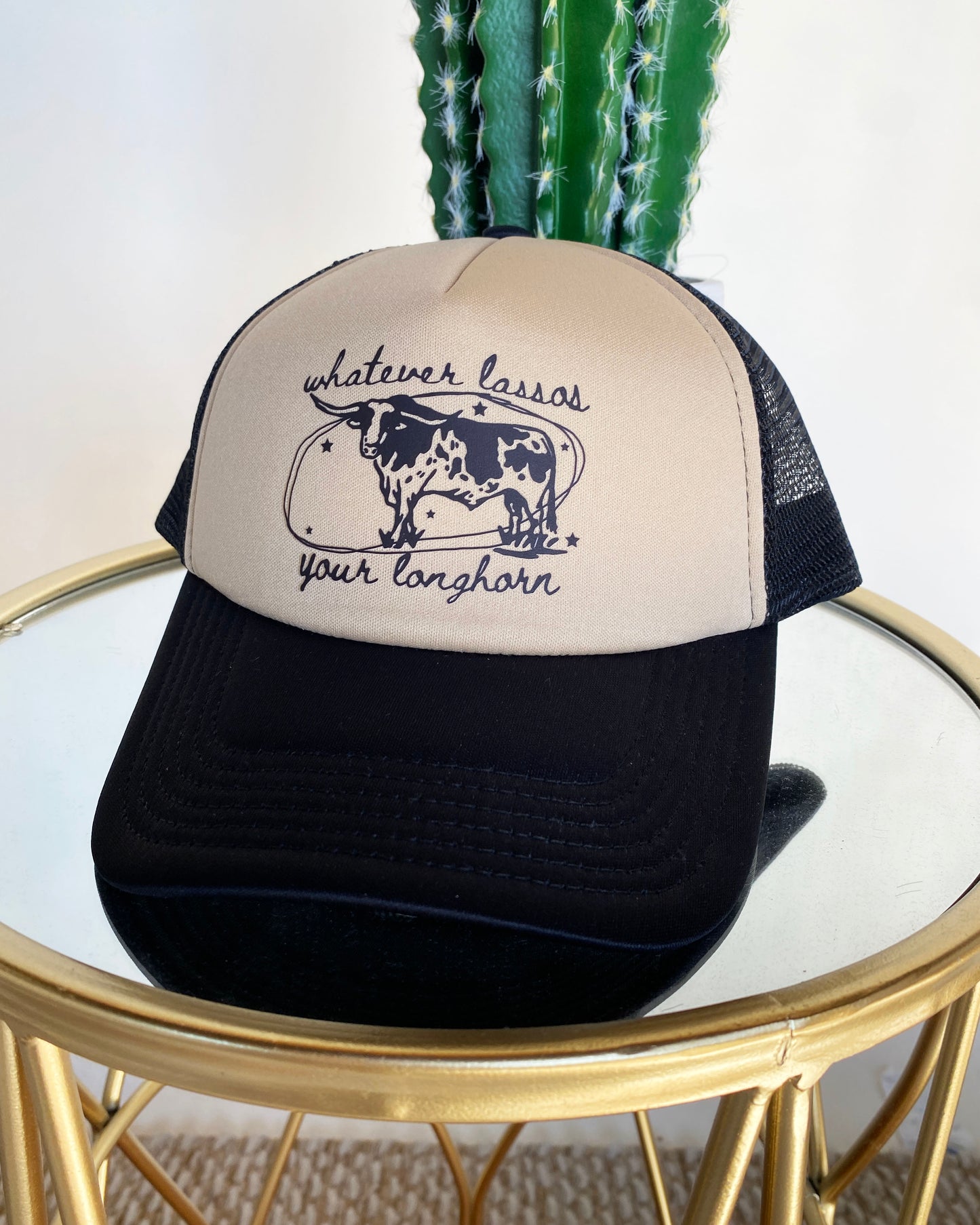 Whatever Lassos Your Longhorn Trucker Hat by Ali Dee - Black and Tan